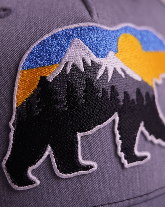 At The Mountains Trucker