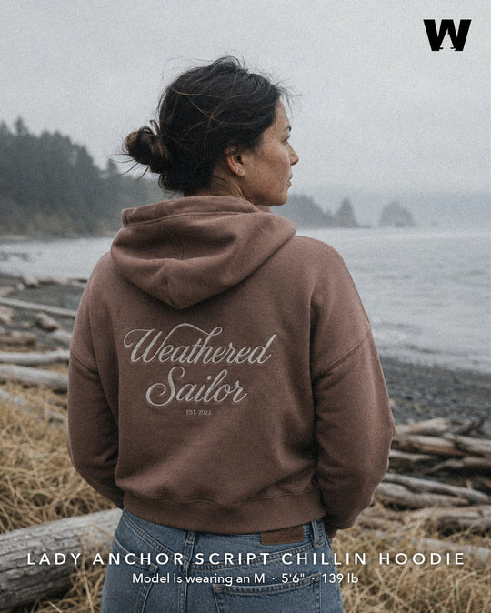 Weathered Sailor — Lady Anchor Script Chillin Hoodie (mocha), model wearing M, back script