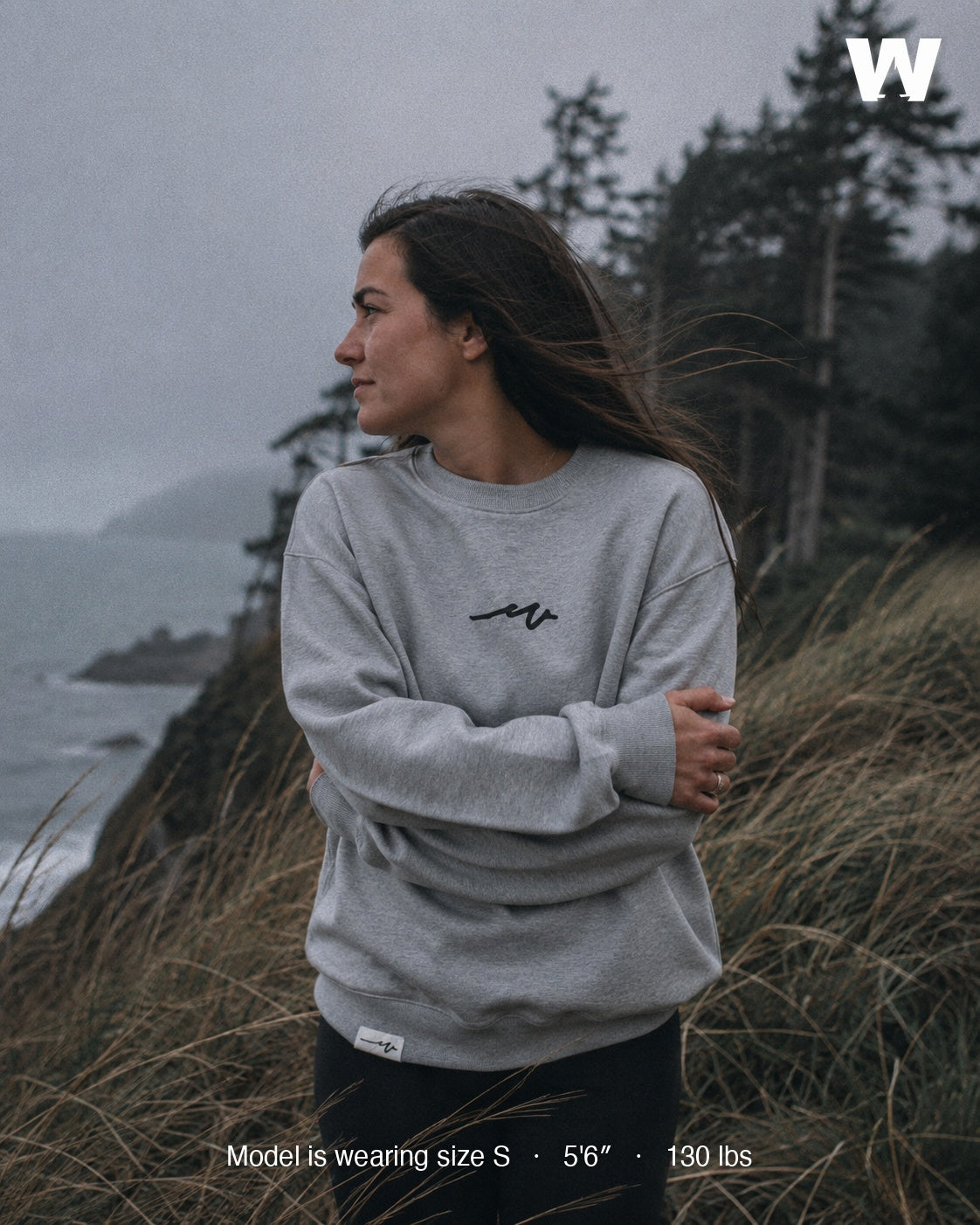 Model wearing the Athletic Heather Puff Dub Heavy Terry Crew on a foggy Pacific Northwest coastal bluff — size S