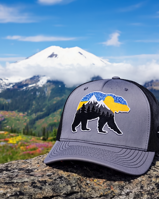 At The Mountains Trucker