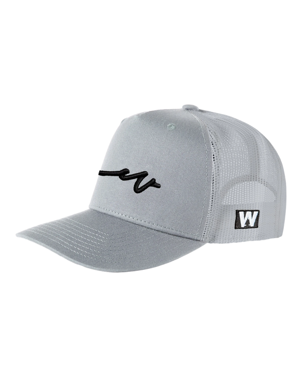 Sketchy Dub Solid Trucker - Black Branding — Smoke / Black, three-quarter front view showing the flat bill and the black mark