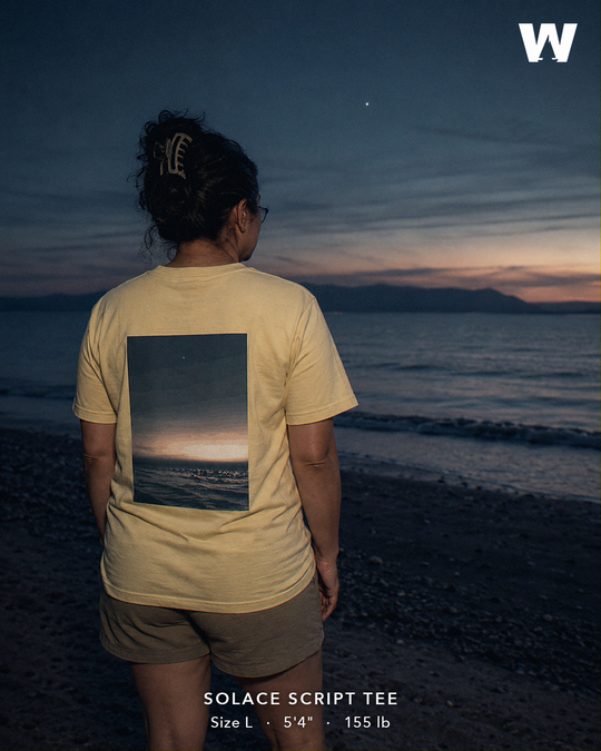 Solace Script Tee — worn back-print lifestyle