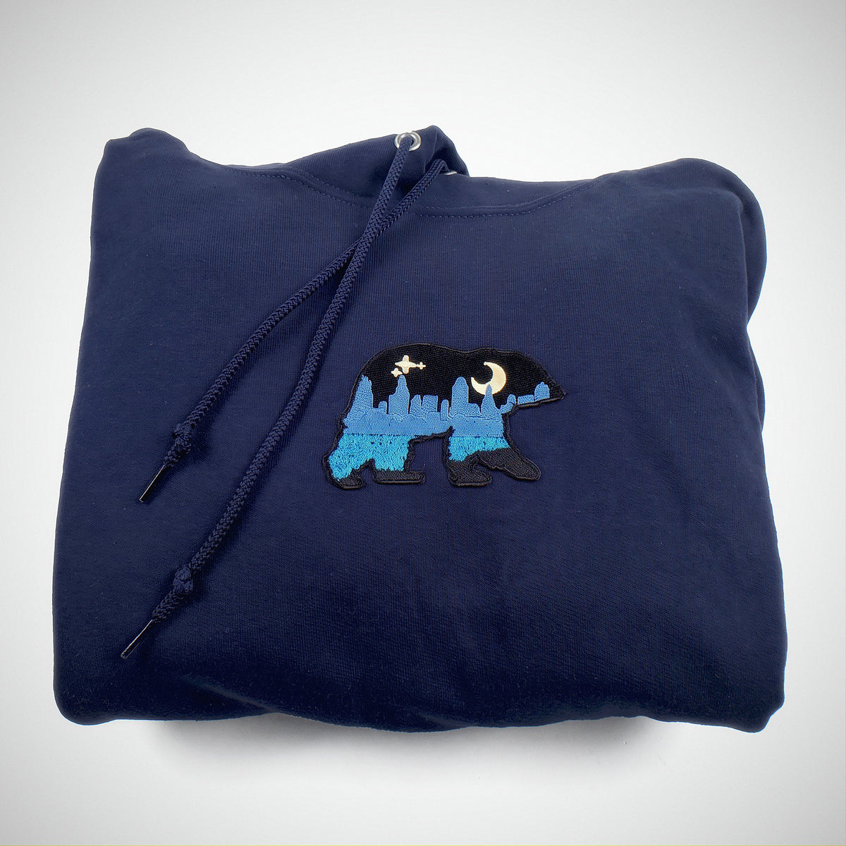 The Bear patch on a navy hoodie.